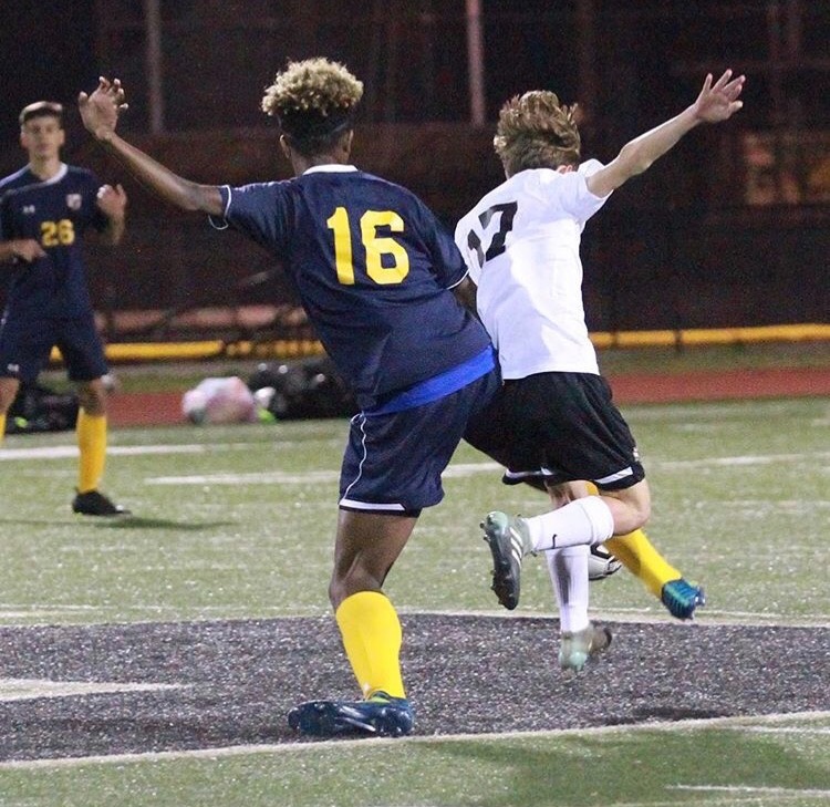 Remy Begg (left) fights for the ball