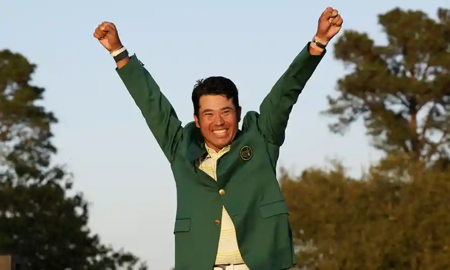 Hideki Matsuyama donning the green jacket as Masters champion