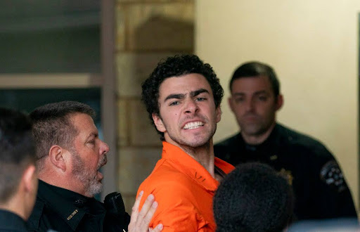 Suspect Luigi Mangione is taken into the Blair County Courthouse on Tuesday, Dec. 10, 2024, in Hollidaysburg, Pa. (Benjamin B. Braun/Pittsburgh Post-Gazette via AP)